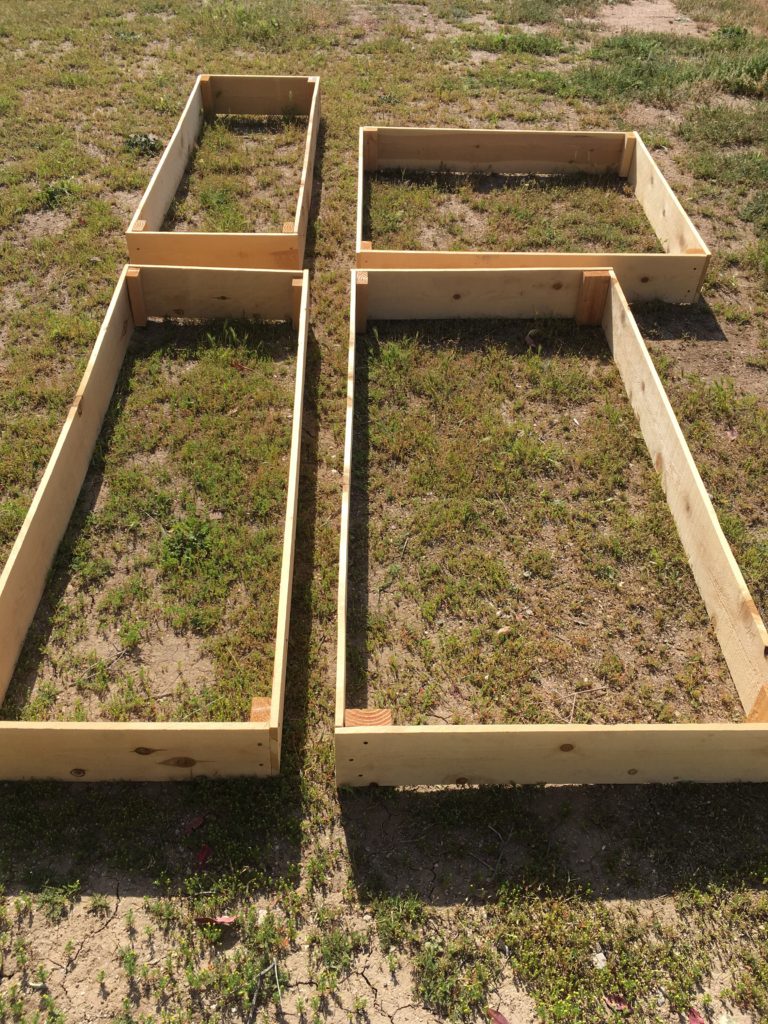 A simple tutorial for DIY cheap raised garden beds made of cedar planks for under $15. You can make these raised garden boxes even cheaper if you have extra cedar fence pickets.